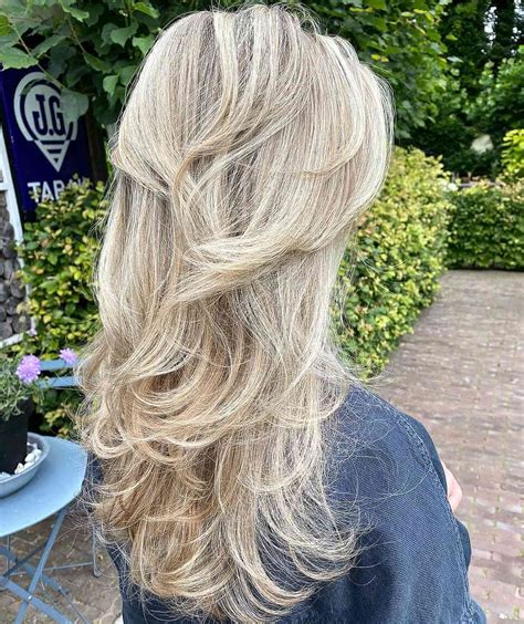 Embrace the Trend: Long Hair with Short Layers on Top for a Dynamic Look