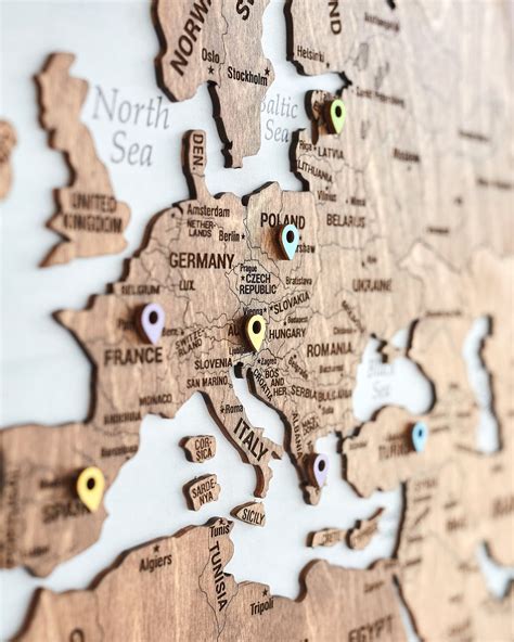 Transform Your Space: World Map Wall Art with Pins for Travelers and Dreamers